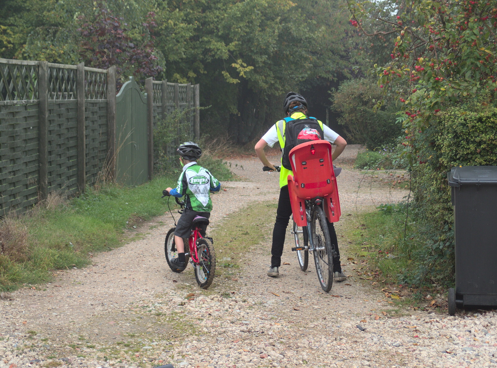 Fred and Isobel head off down the drive from Bike Rides and the BSCC at the Railway, Mellis and Brome, Suffolk - 18th September 2014