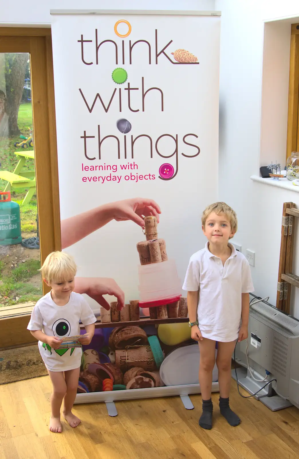 Fred stands in front of the poster with his hands in, from Fred's Shop, Brome, Suffolk - 20th September 2014