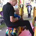 Grandad takes Harry on the gallopers, A Trip to Bressingham Steam Museum, Bressingham, Norfolk - 28th September 2014