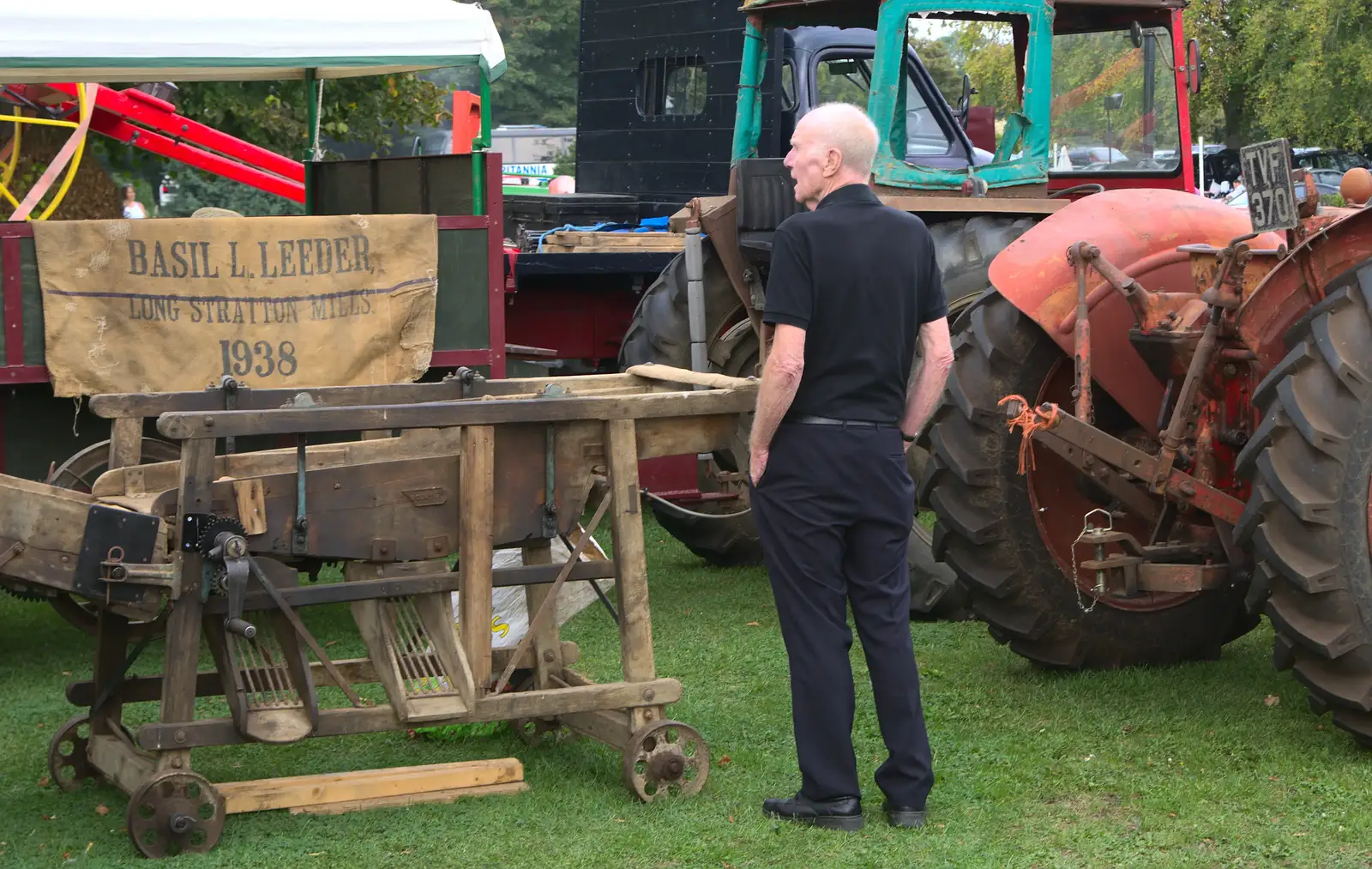 Grandad looks about old agricultural machinery, from A Trip to Bressingham Steam Museum, Bressingham, Norfolk - 28th September 2014