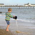 Fred tips some water back in to the sea, On The Beach Again, Southwold, Suffolk - 12th October 2014