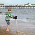 Fred tips some water back in to the sea, On The Beach Again, Southwold, Suffolk - 12th October 2014