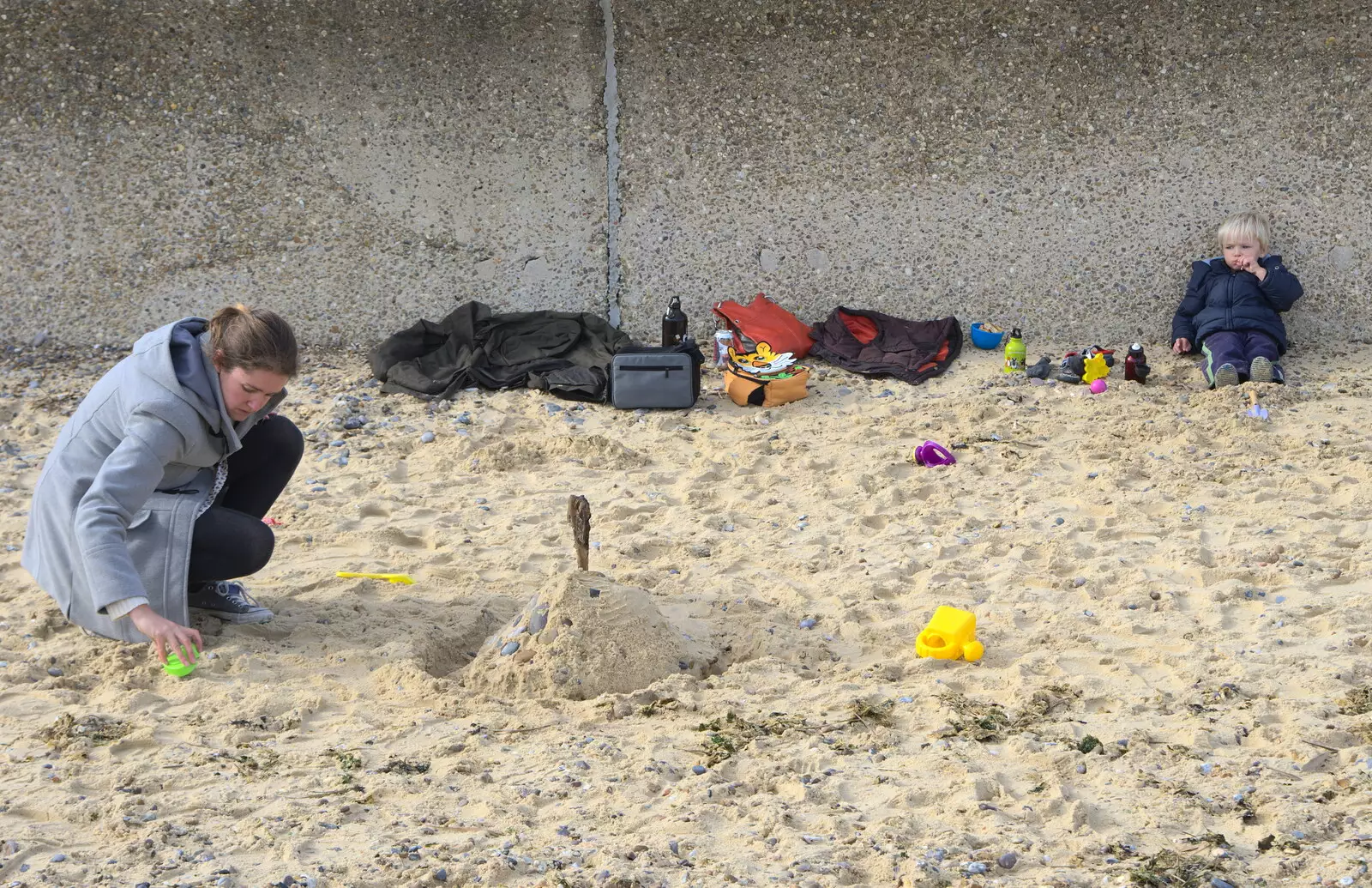 Harry sits against the wall, from On The Beach Again, Southwold, Suffolk - 12th October 2014