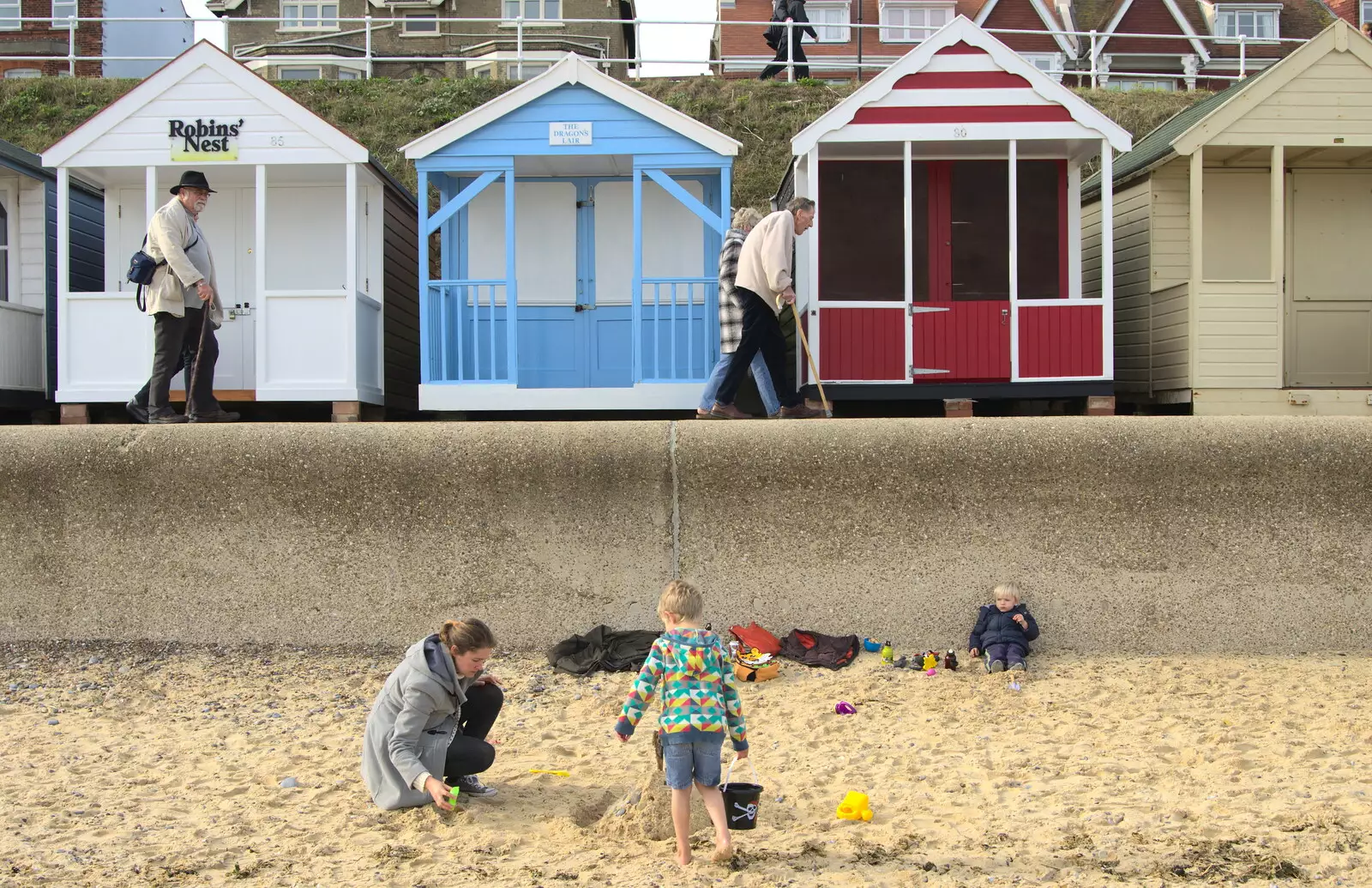 Isobel and the boys mess around under the prom, from On The Beach Again, Southwold, Suffolk - 12th October 2014