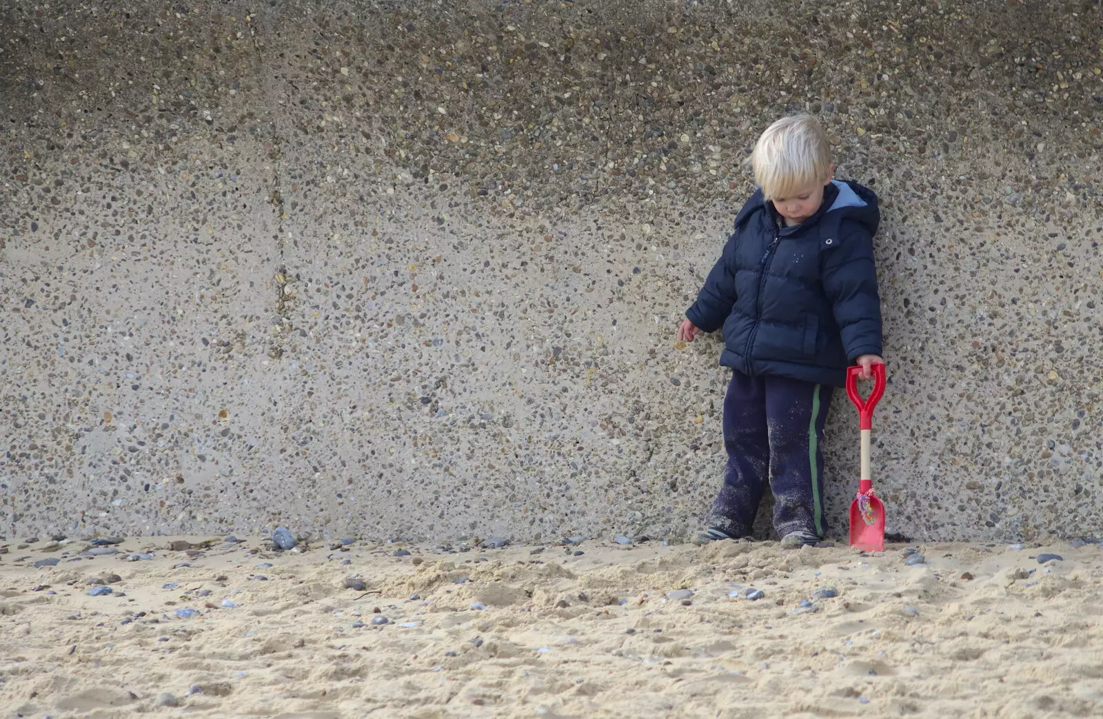 Harry pokes the sand with a spade, from On The Beach Again, Southwold, Suffolk - 12th October 2014