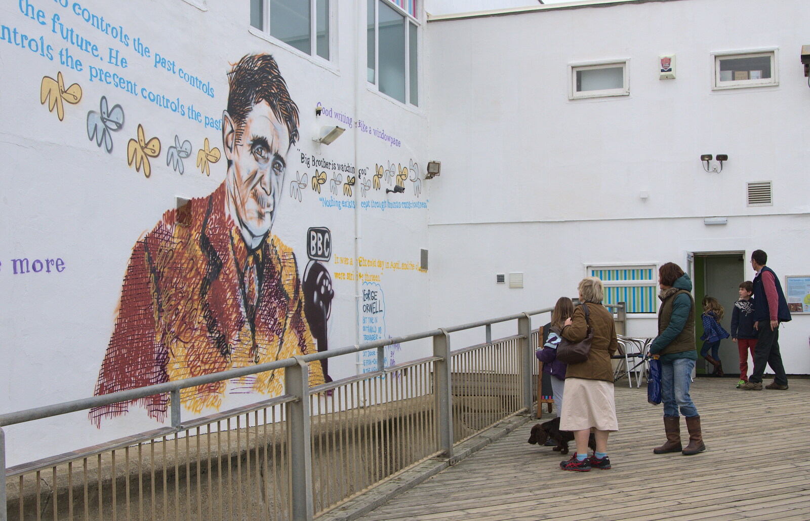 People look at the new George Orwell mural from On The Beach Again, Southwold, Suffolk - 12th October 2014
