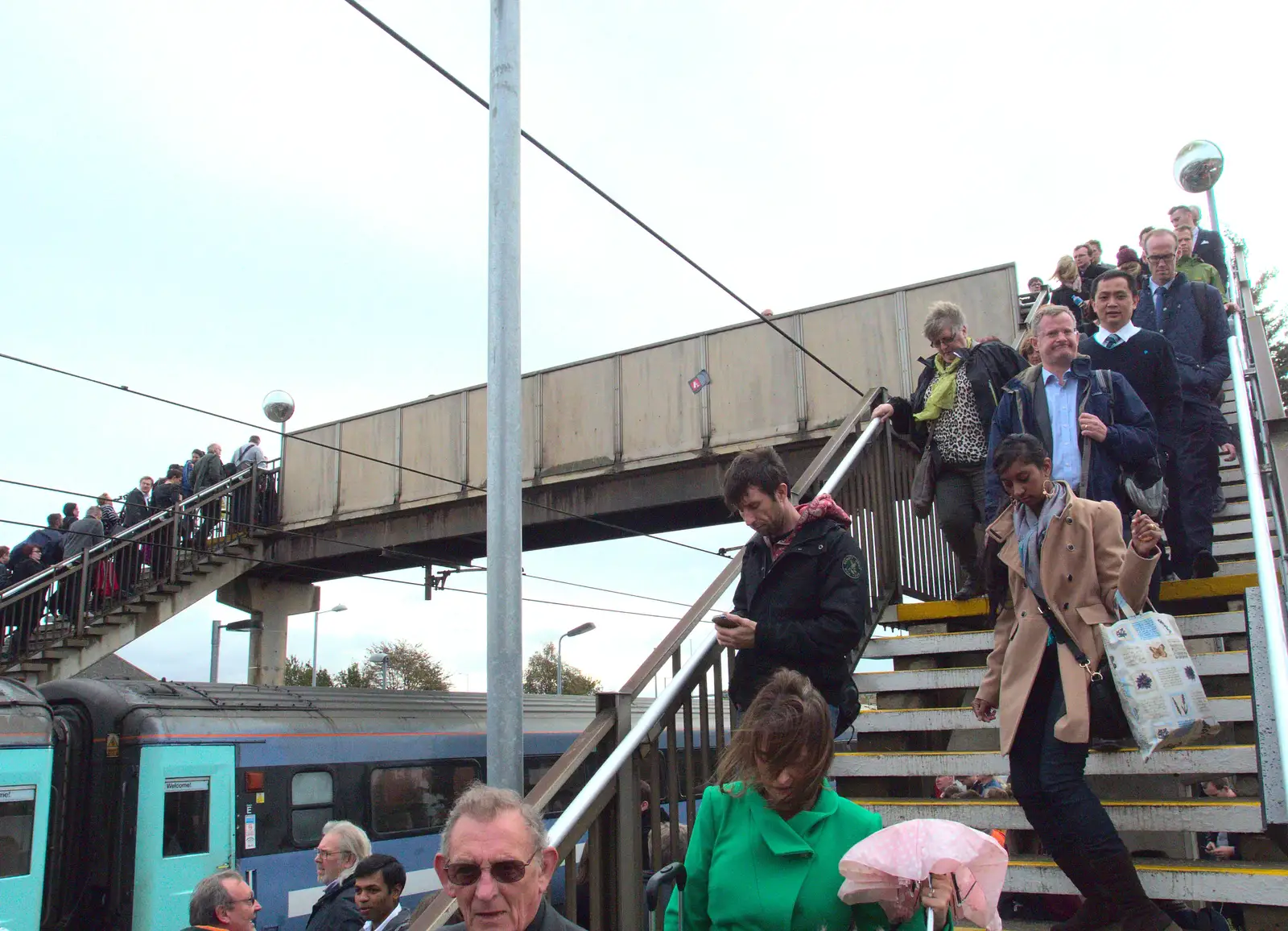 A stream of people cross the bridge, from (Very) Long Train (Not) Running, Stowmarket, Suffolk - 21st October 2014