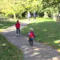 Harry runs after a scooting Fred, Another Walk around Thornham Estate, Suffolk - 27th October 2014