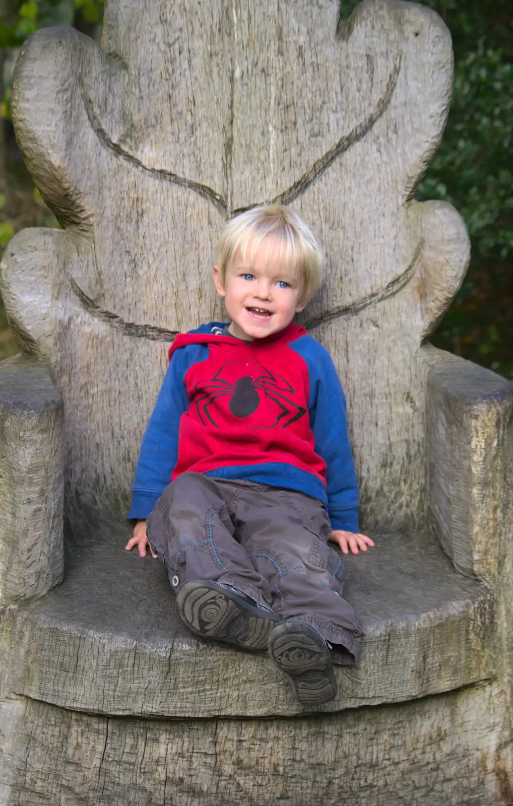 Harry sits in the wooden throne, from Another Walk around Thornham Estate, Suffolk - 27th October 2014