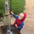 Harry has a go of the pump, A Trip to Abbey Gardens, Bury St. Edmunds, Suffolk - 29th October 2014