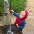 Harry has a go of the pump, A Trip to Abbey Gardens, Bury St. Edmunds, Suffolk - 29th October 2014