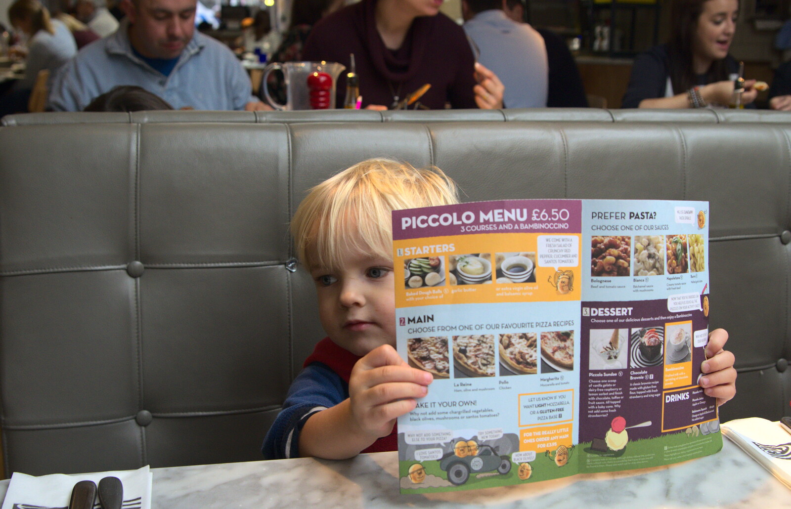 Harry checks out the menu in Pizza Express from A Trip to Abbey Gardens, Bury St. Edmunds, Suffolk - 29th October 2014