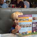 Harry checks out the menu in Pizza Express, A Trip to Abbey Gardens, Bury St. Edmunds, Suffolk - 29th October 2014
