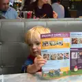 Harry checks out the menu in Pizza Express, A Trip to Abbey Gardens, Bury St. Edmunds, Suffolk - 29th October 2014