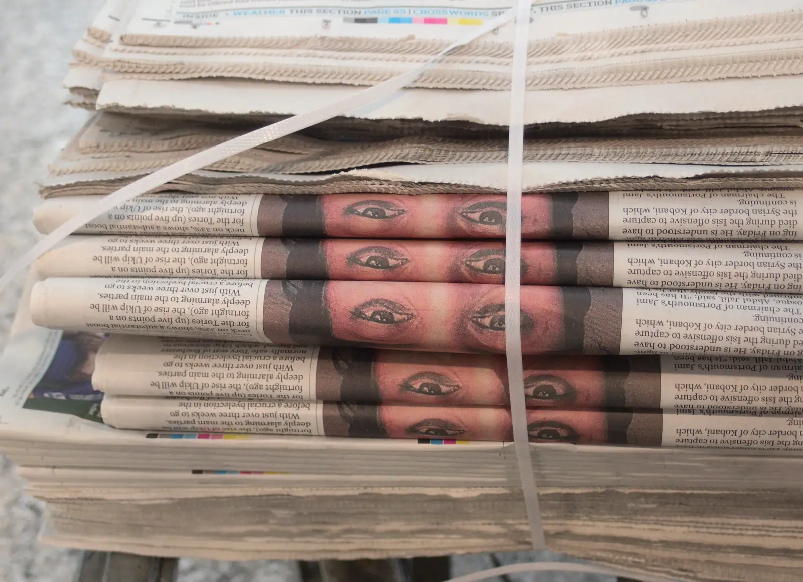 Loads of eyes stare out from a stack of newspapers, from A Bomb Scare and Fred Does Building, London and Suffolk - 30th October 2014