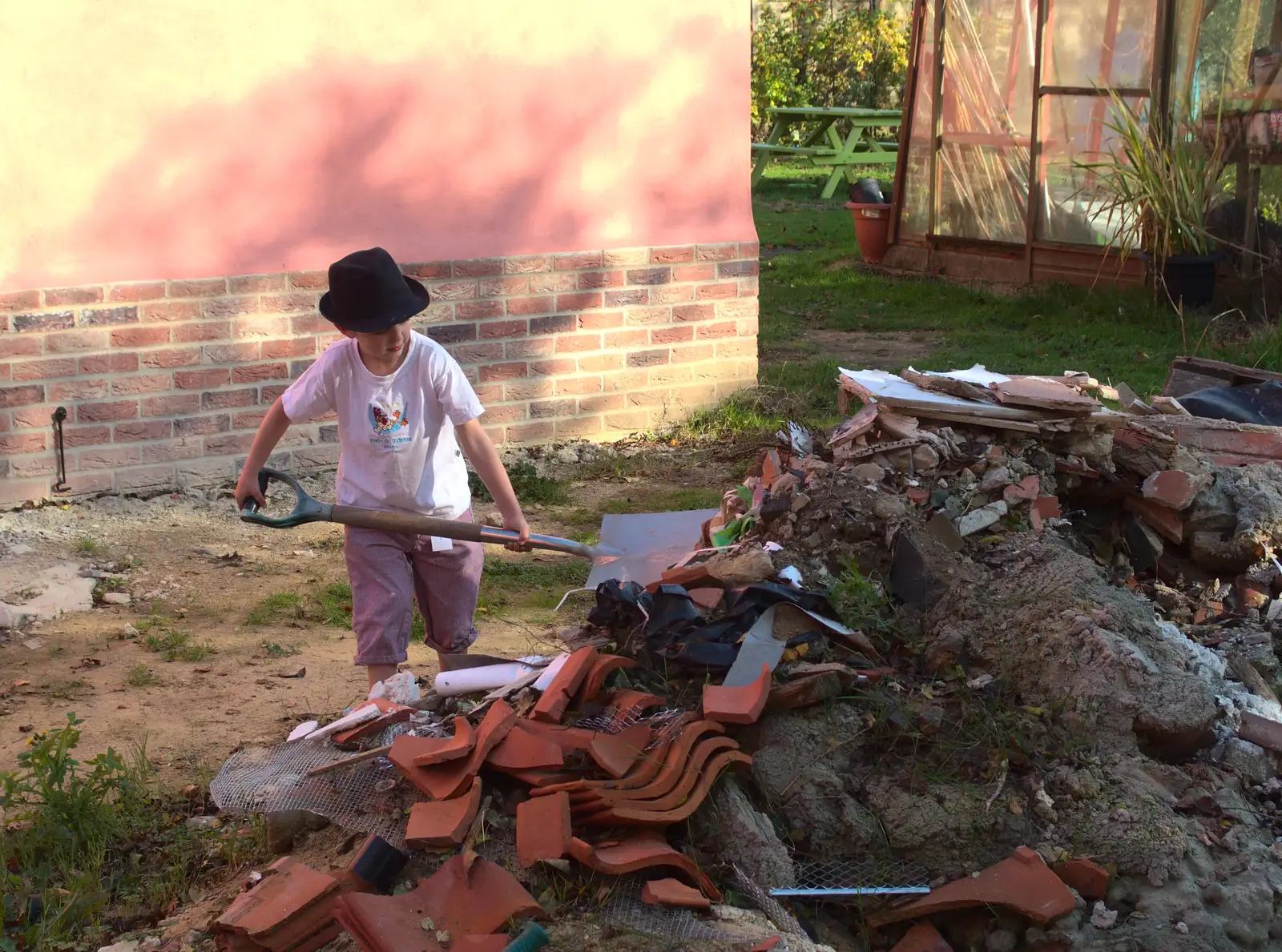 Fred excavates for lumps of concrete and tile, from A Bomb Scare and Fred Does Building, London and Suffolk - 30th October 2014