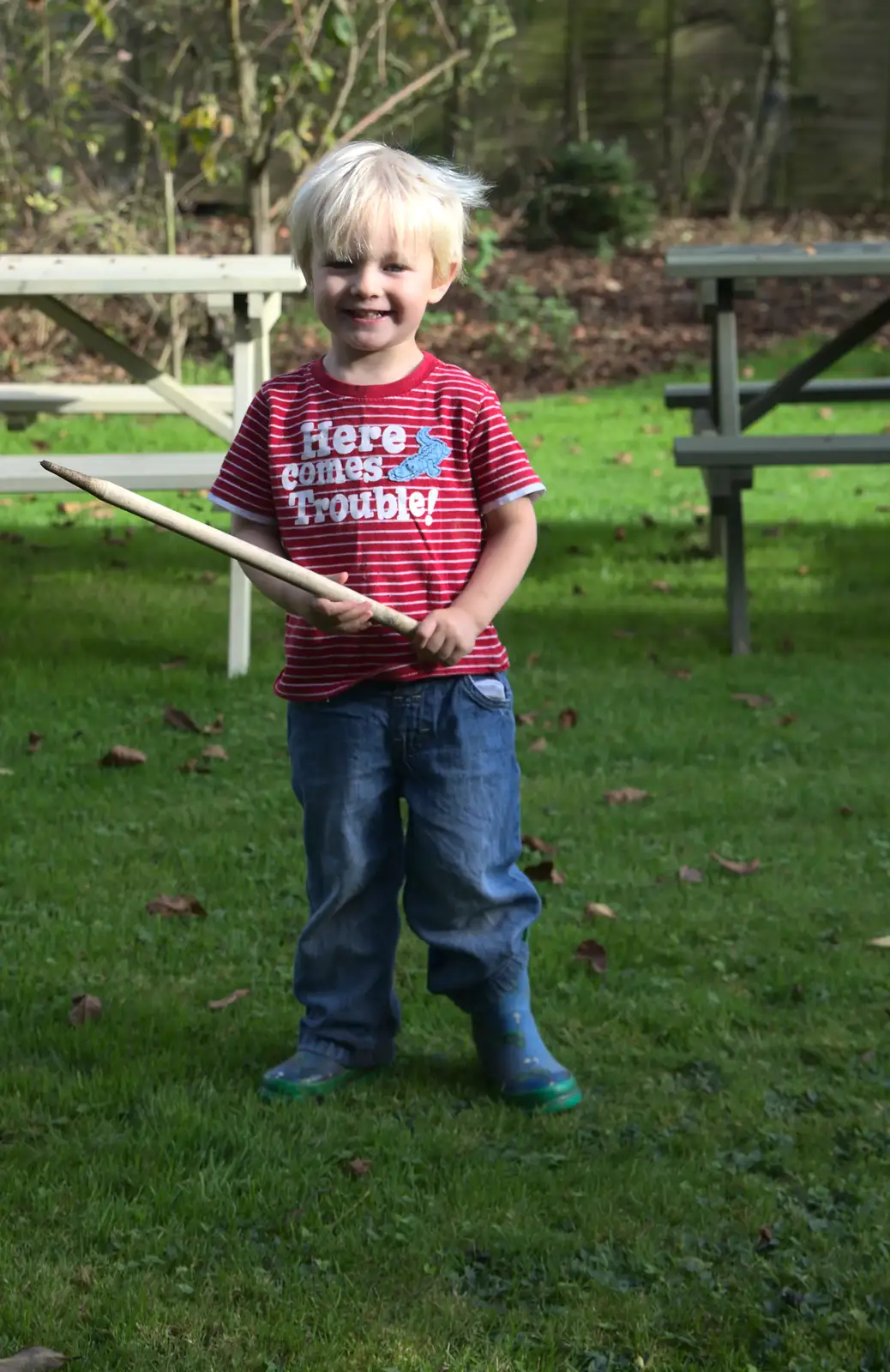 Harry looks for stuff to whack, from A Walk on Wortham Ling, Diss, Norfolk - 30th October 2014