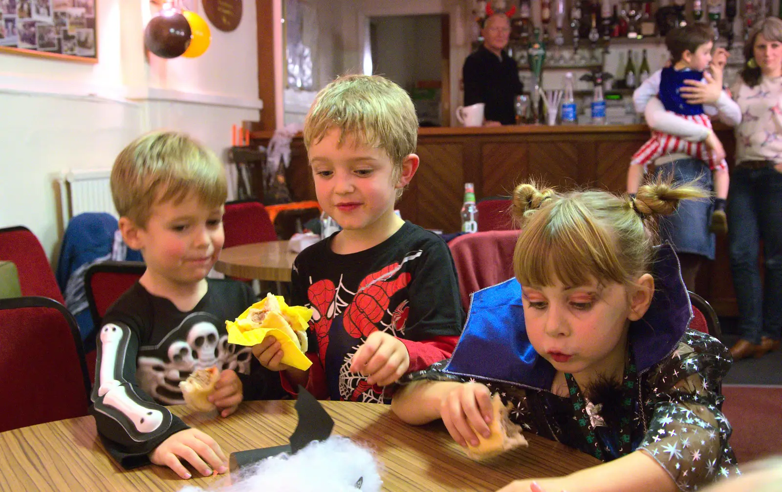 Fred eats a sausage, from A Halloween Party at the Village Hall, Brome, Suffolk - 31st October 2014