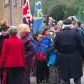 A flag-bearer gives a salute, A Remembrance Sunday Parade, Eye, Suffolk - 9th November 2014