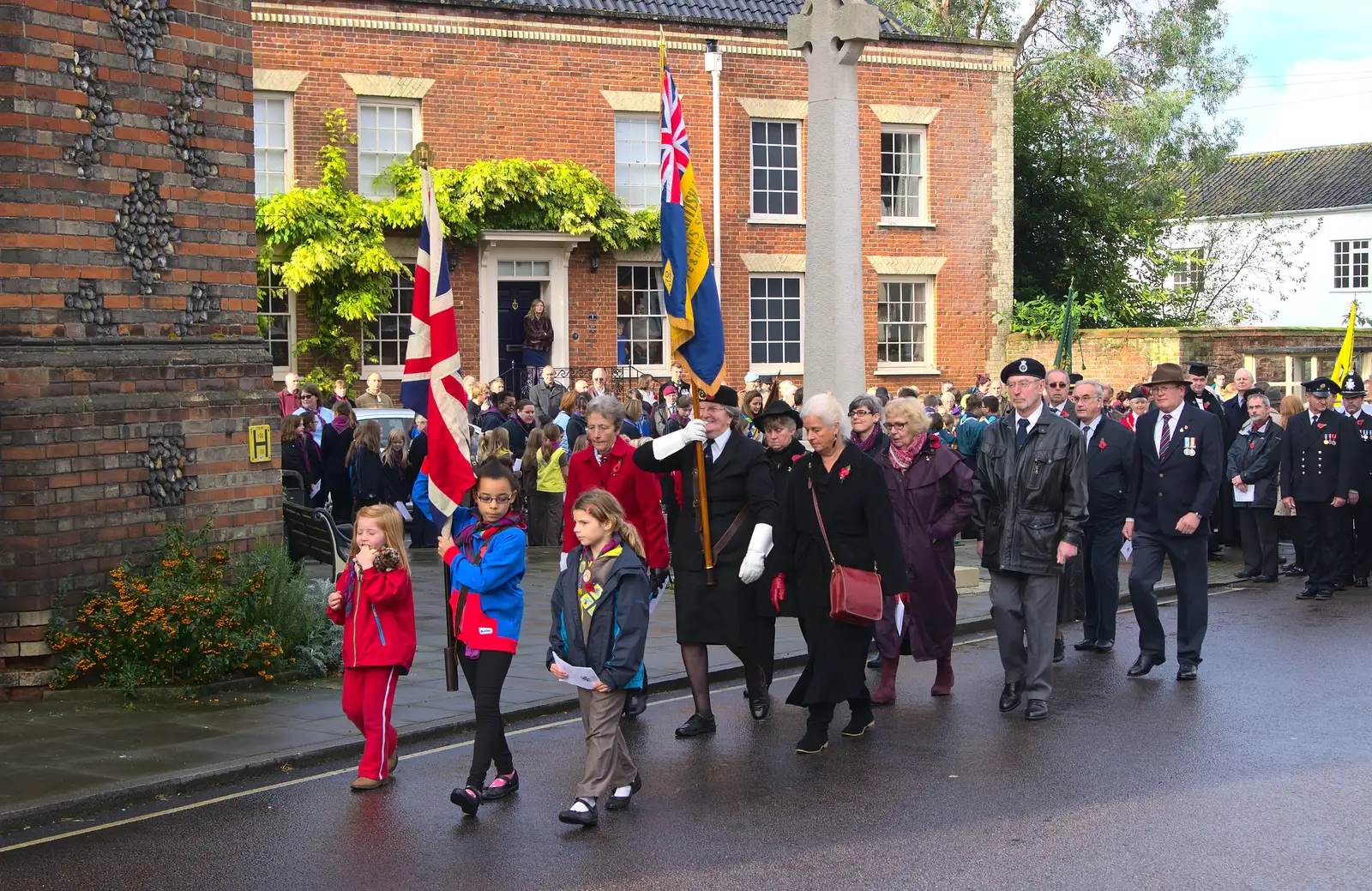 The parade continues on towards the church, from A Remembrance Sunday Parade, Eye, Suffolk - 9th November 2014