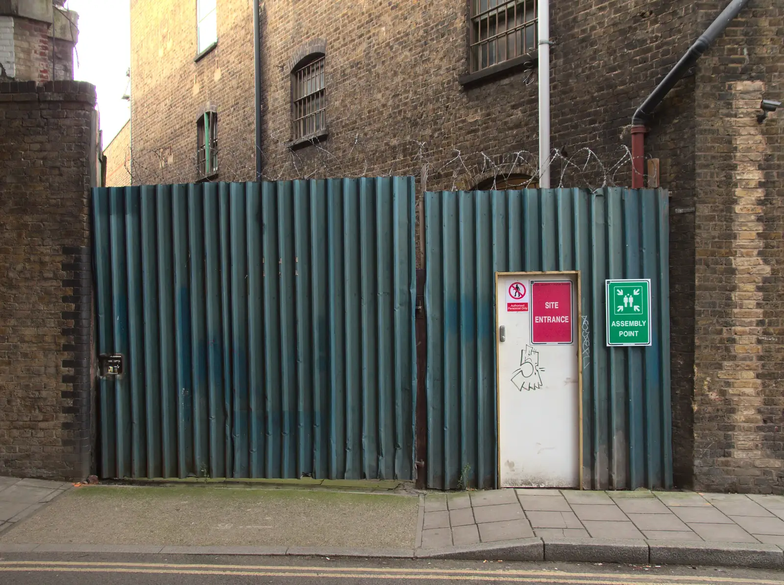 A barb-wired gate on O'Meara Street, from A Melting House Made of Wax, Southwark, London - 12th November 2014