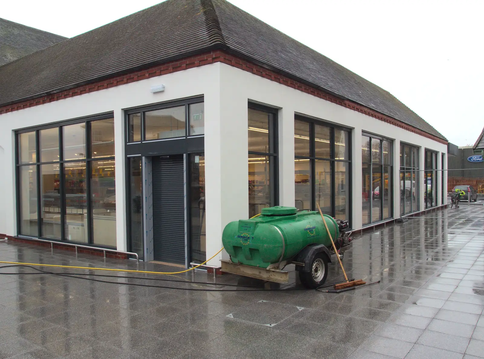 Aldi's new paved area gets a hose down, from November Singing, Gislingham Primary School, Suffolk - 17th November 2014