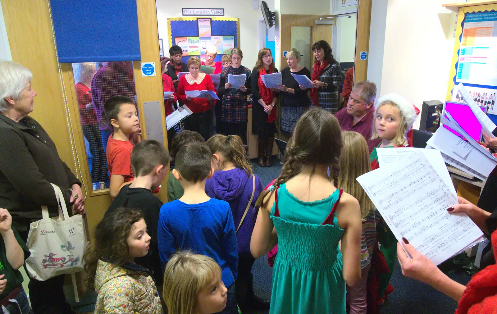 A crowd of children gather to watch, from November Singing, Gislingham Primary School, Suffolk - 17th November 2014