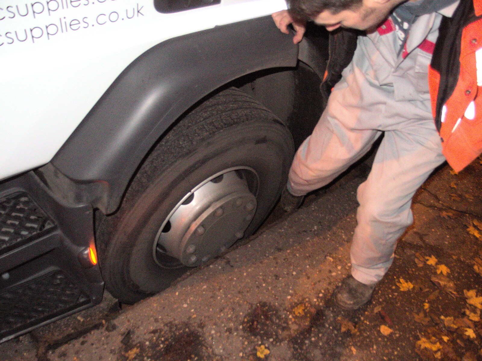 The Humphries tow-truck driver checks the hole out from The Lorry-Eating Pavement of Diss, Norfolk - 3rd December