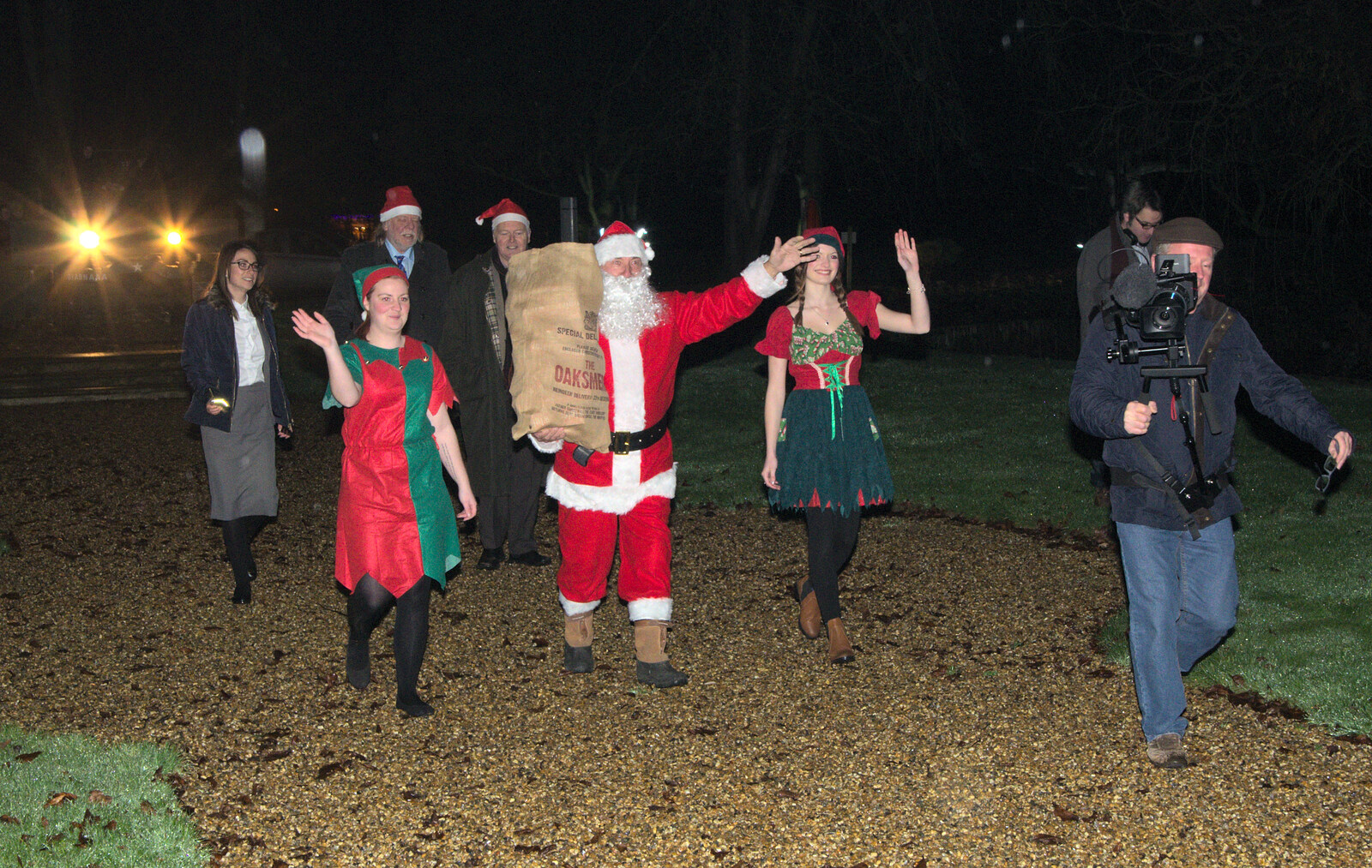 Santa walks up the path from Rick Wakeman, Ian Lavender and the Christmas lights, The Oaksmere, Suffolk - 4th December 2014