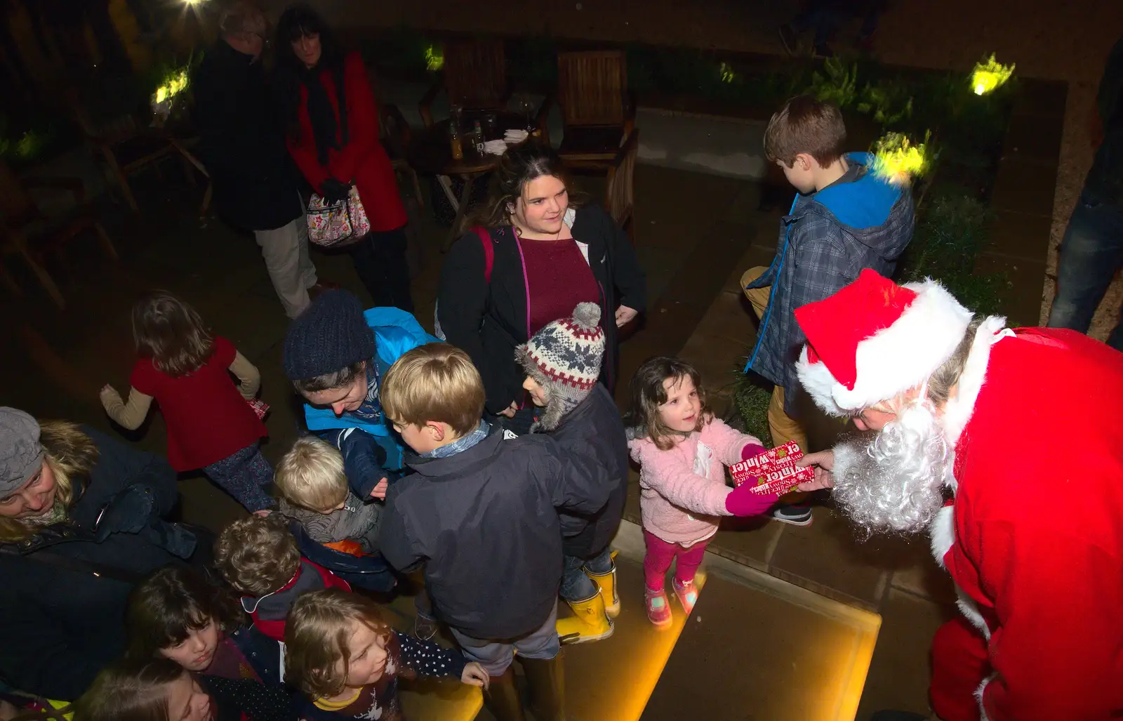 Santa hands presents out, from Rick Wakeman, Ian Lavender and the Christmas lights, The Oaksmere, Suffolk - 4th December 2014