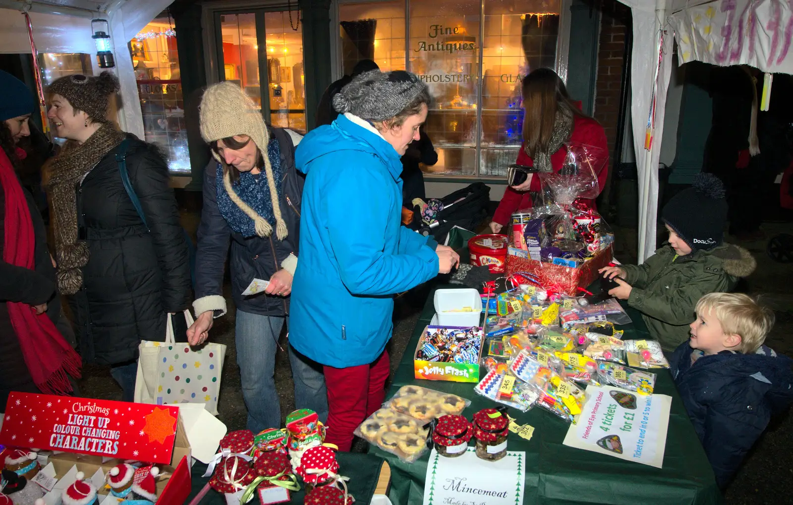 Harry and Fred buy some stuff on the FOES stall, from The Eye Lights and a Thorpe Abbots Birthday, Suffolk and Norfolk - 6th December 2014