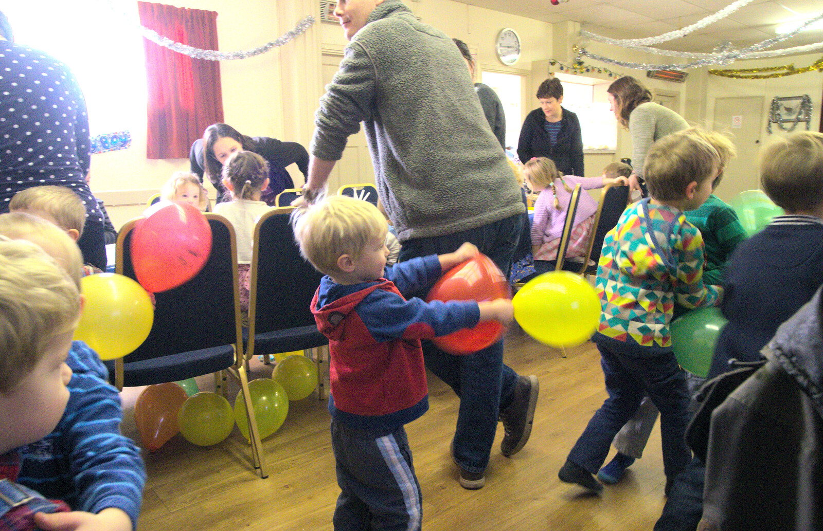 Harry chases people whilst weilding balloons from The Eye Lights and a Thorpe Abbots Birthday, Suffolk and Norfolk - 6th December 2014