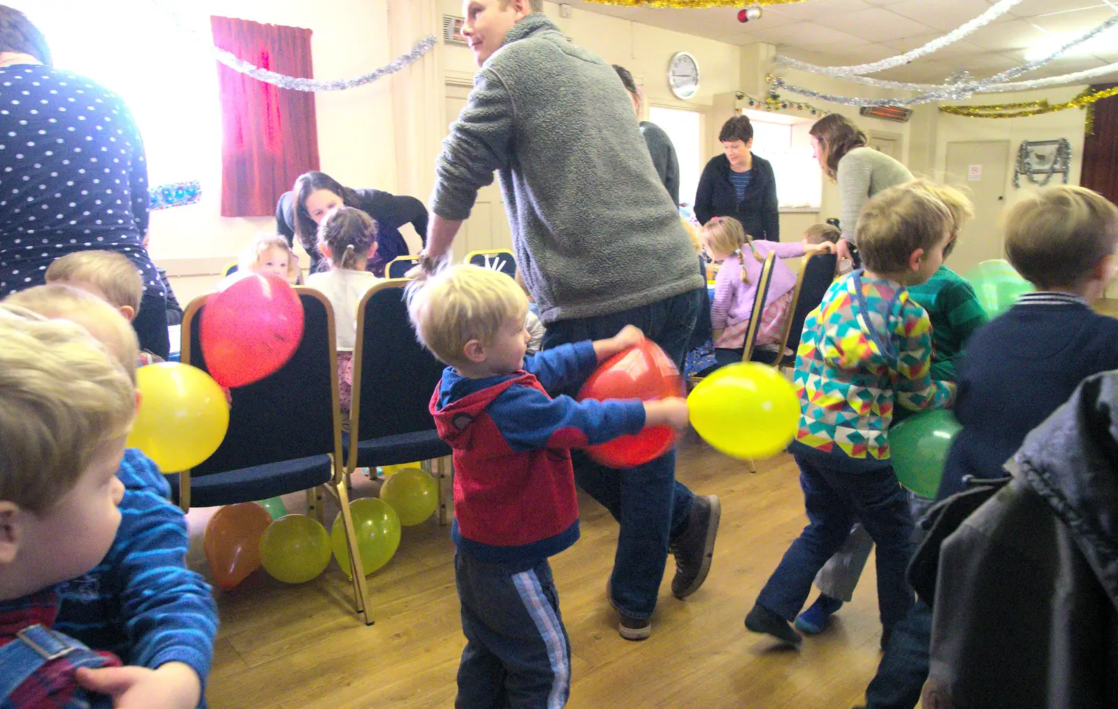 Harry chases people whilst weilding balloons, from The Eye Lights and a Thorpe Abbots Birthday, Suffolk and Norfolk - 6th December 2014