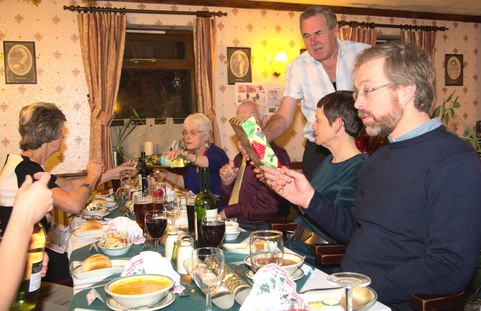 Alan hands some presents out from The BSCC Christmas Dinner, The Swan Inn, Brome, Suffolk - 6th December 2014