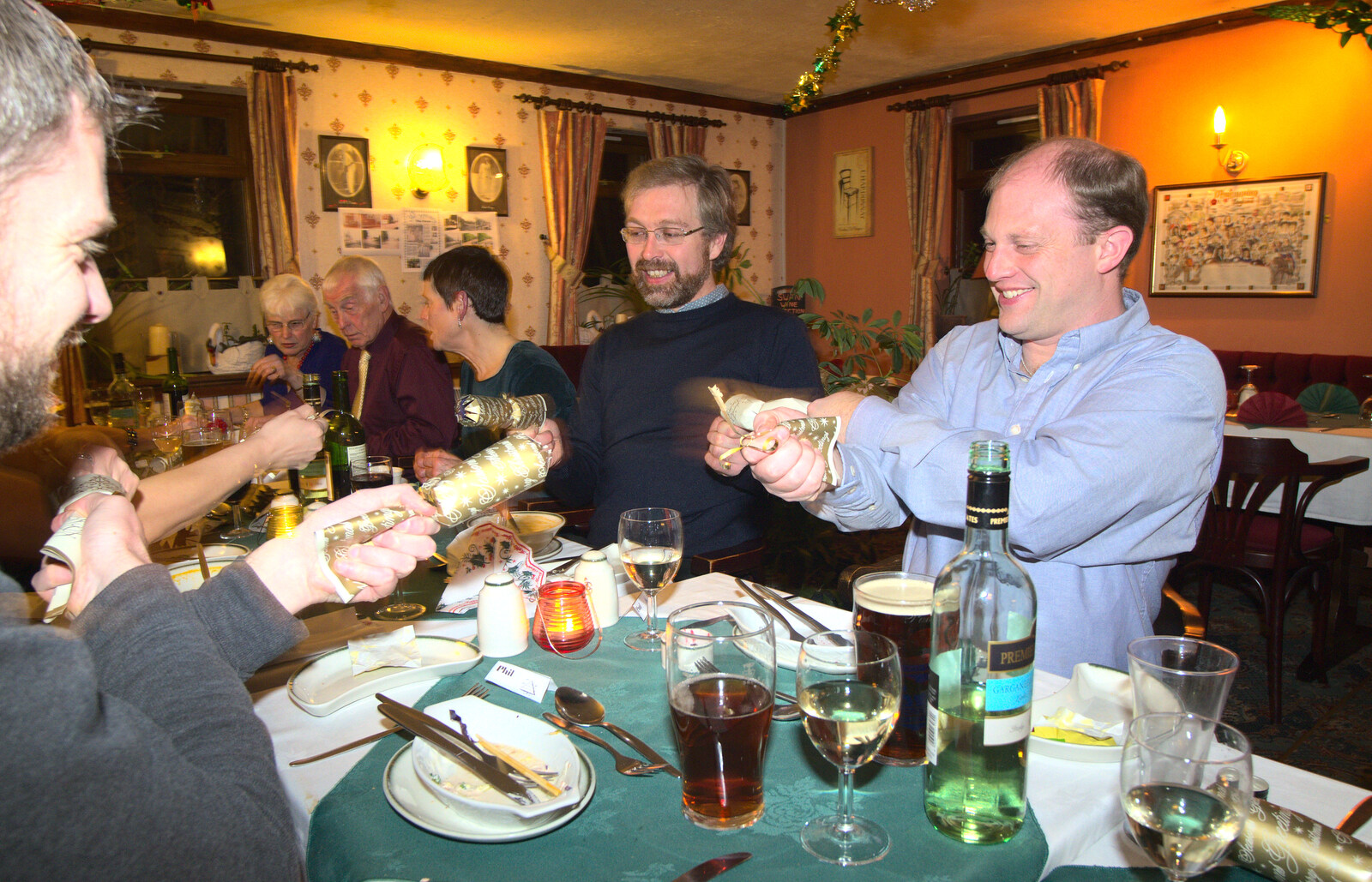 Crackers are pulled from The BSCC Christmas Dinner, The Swan Inn, Brome, Suffolk - 6th December 2014