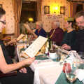 The BSCC Christmas Dinner, The Swan Inn, Brome, Suffolk - 6th December 2014, Suey scopes the quiz out