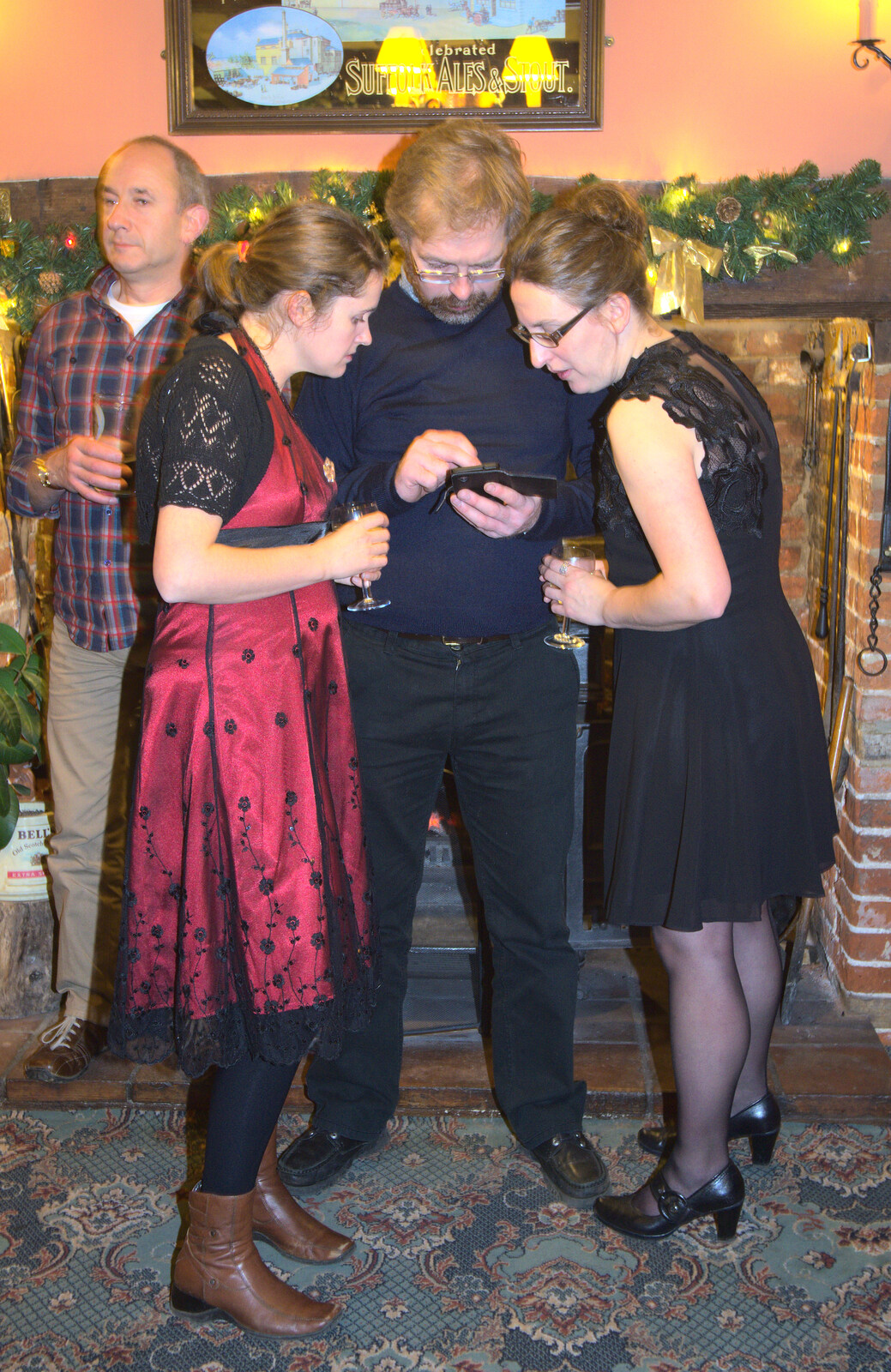 Something's occuring on Marc's phone from The BSCC Christmas Dinner, The Swan Inn, Brome, Suffolk - 6th December 2014