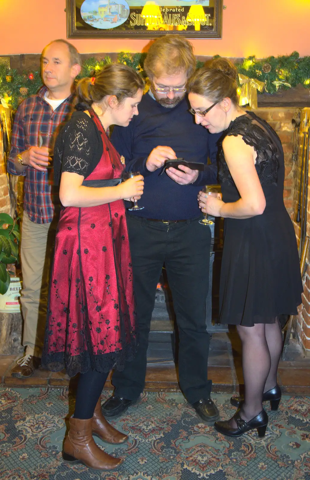 Something's occuring on Marc's phone, from The BSCC Christmas Dinner, The Swan Inn, Brome, Suffolk - 6th December 2014