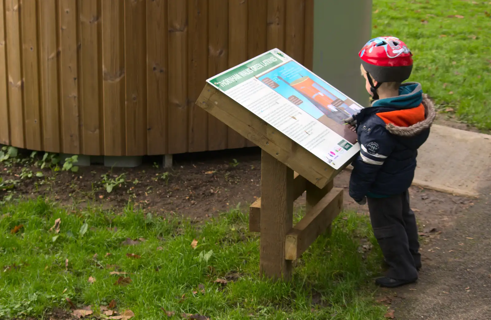 Harry reads about how the compost bogs work, from Cameraphone Randomness and a Thornham Walk, Suffolk - 14th December 2014