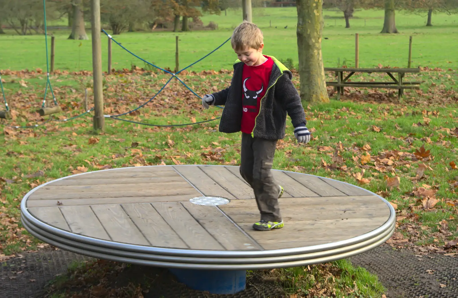 Fred spins round on a roundabout, from Cameraphone Randomness and a Thornham Walk, Suffolk - 14th December 2014