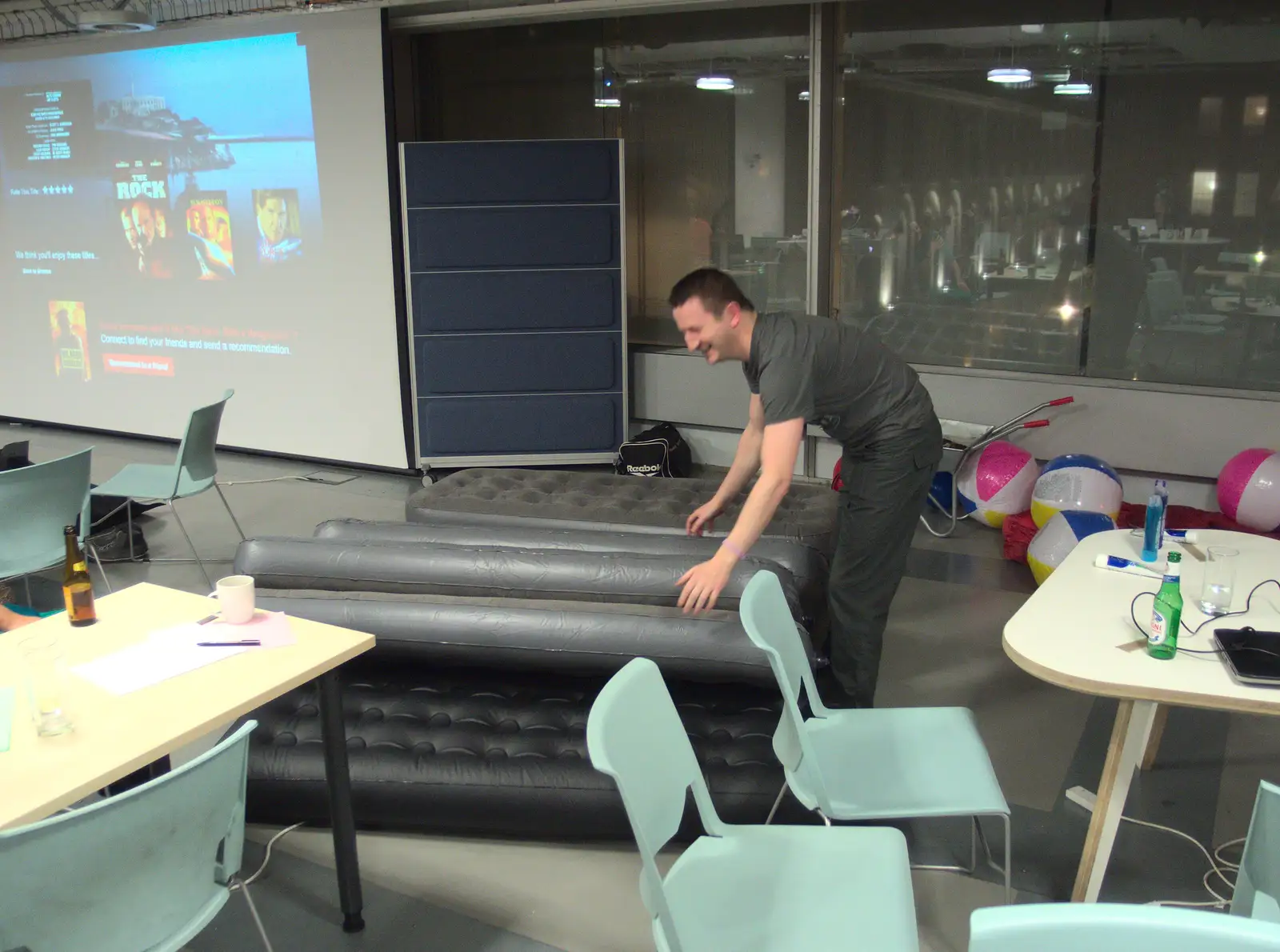 Joe moves some airbeds around, from SwiftKey Innovation Nights, Westminster, London - 19th December 2014