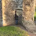 Fred peers into an arrow slit, A Trip to Abbey Gardens, Bury St. Edmunds, Suffolk - 20th December 2014