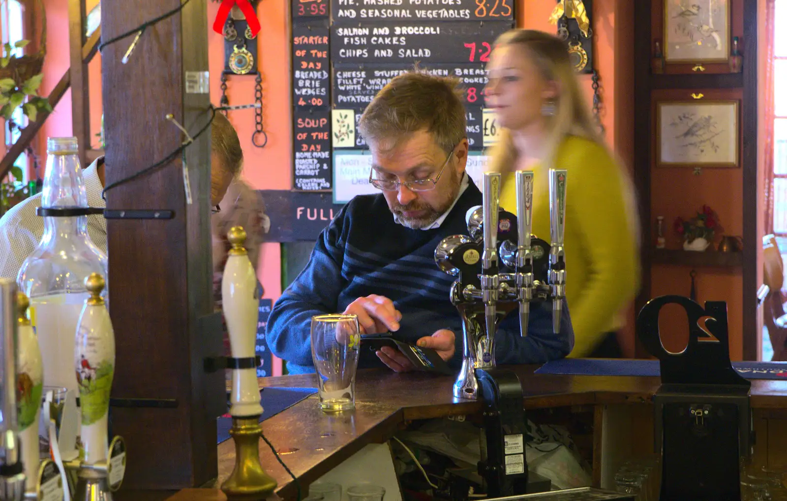 Marc pokes around on his phone, from Christmas Day at the Swan Inn, Brome, Suffolk - 25th December 2014