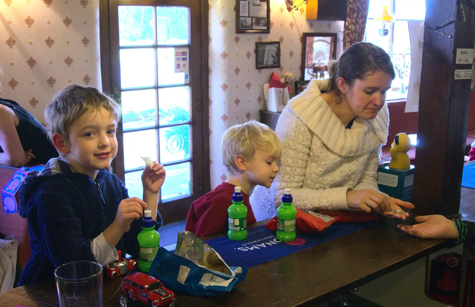 Fred and Harry eat crisps at the bar, from Christmas Day at the Swan Inn, Brome, Suffolk - 25th December 2014