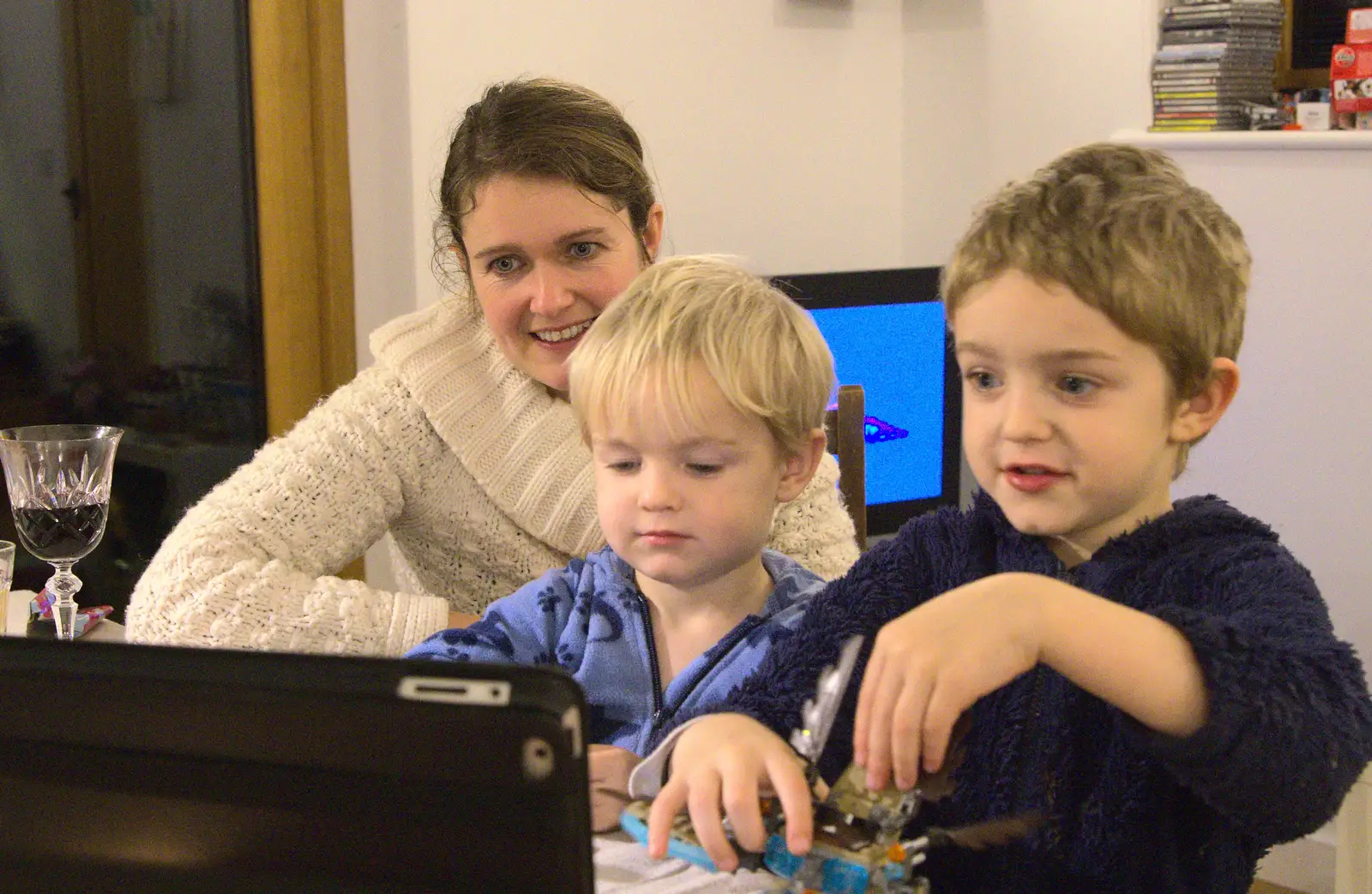 Isobel and the boys Skype someone, from Christmas Day at the Swan Inn, Brome, Suffolk - 25th December 2014