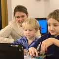 Isobel and the boys Skype someone, Christmas Day at the Swan Inn, Brome, Suffolk - 25th December 2014