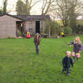 Christmas Day at the Swan Inn, Brome, Suffolk - 25th December 2014, The children run around the garden with sticks