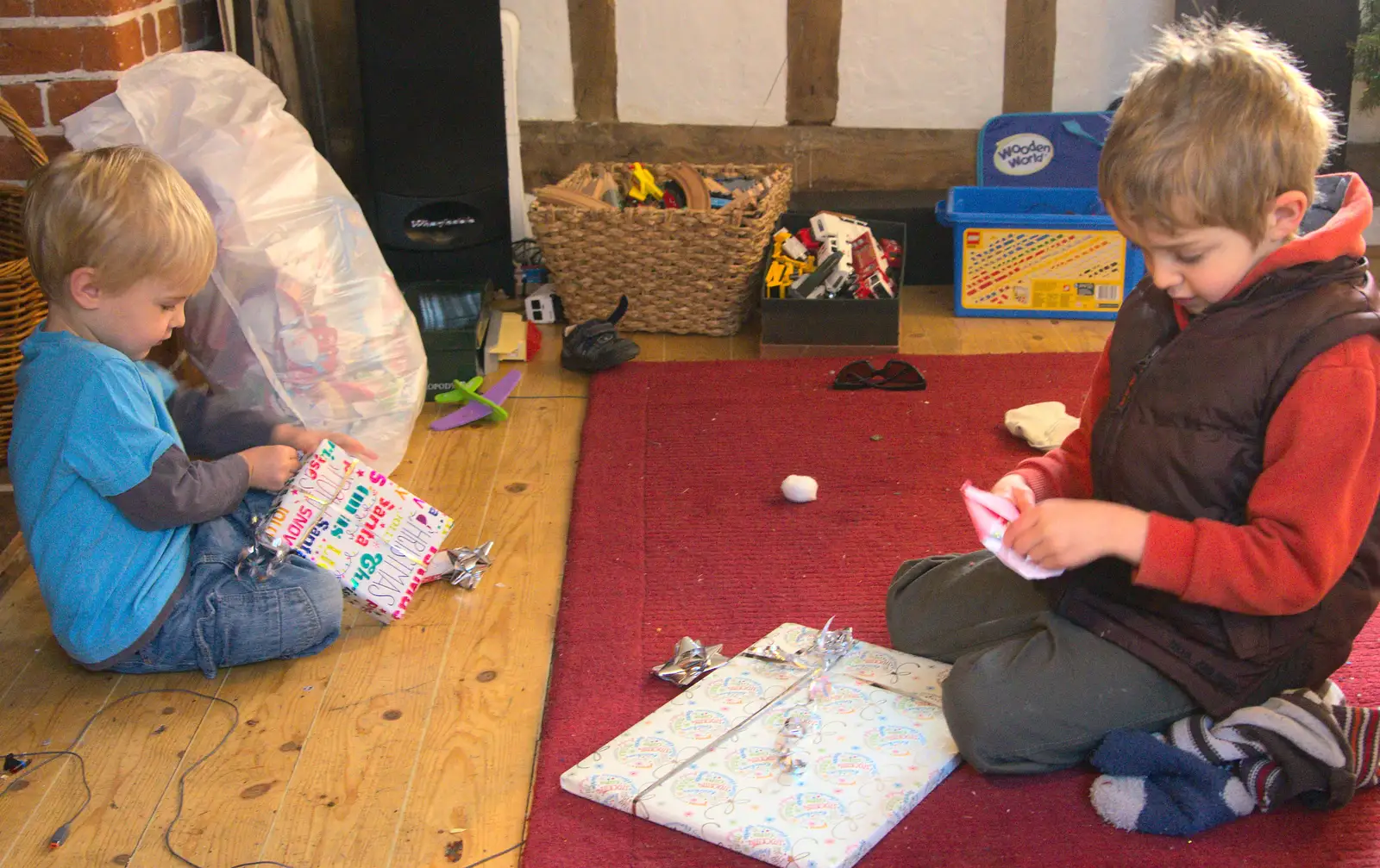 The boys find more presents to open, from Christmas Day at the Swan Inn, Brome, Suffolk - 25th December 2014