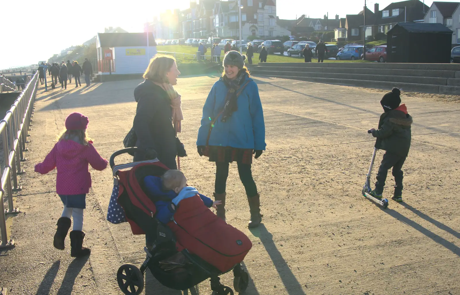 Isobel bumps in to someone she knows, from Sunset on the Beach, Southwold, Suffolk - 30th December 2014