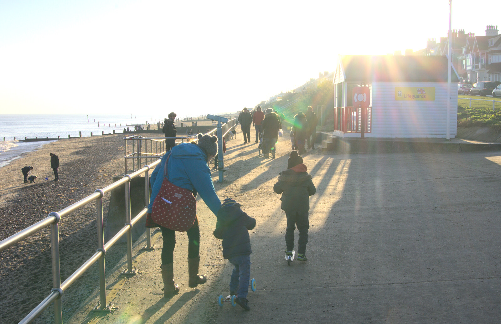We head off down the promenade from Sunset on the Beach, Southwold, Suffolk - 30th December 2014